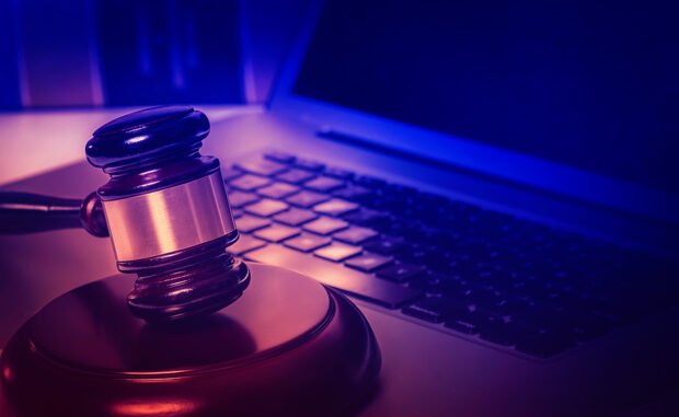 Legal law concept image, gavel on computer